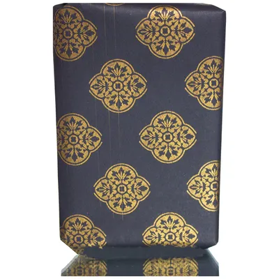 Gift wrapping paper with golden ornaments